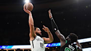 Nov 8, 2024; Boston, Massachusetts, USA;  Brooklyn Nets guard Ben Simmons (10) shoots the ball over Boston Celtics center Neemias Queta (88) during the first half at TD Garden. Mandatory Credit: Bob DeChiara-Imagn Images
