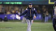 Nov 23, 2024; Morgantown, West Virginia, USA; West Virginia Mountaineers head coach Neal Brown argues a call during the fourth quarter against the UCF Knights at Mountaineer Field at Milan Puskar Stadium. Mandatory Credit: Ben Queen-Imagn Images