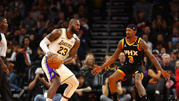 Nov 26, 2024; Phoenix, Arizona, USA; Los Angeles Lakers forward LeBron James (23) against Phoenix Suns guard Bradley Beal (3) during an NBA Cup game at Footprint Center. Mandatory Credit: Mark J. Rebilas-Imagn Images