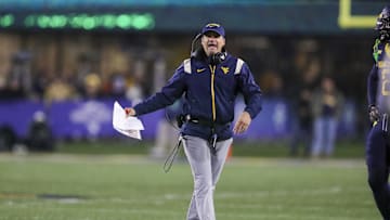 Nov 23, 2024; Morgantown, West Virginia, USA; West Virginia Mountaineers head coach Neal Brown argues a call during the fourth quarter against the UCF Knights at Mountaineer Field at Milan Puskar Stadium. Mandatory Credit: Ben Queen-Imagn Images