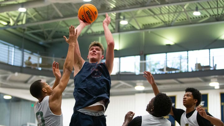 Heritage Hills' Trent Sisley, second from left, shoots the ball during a scrimmage at the Notre Dame Team Camp at Rolfs Athletics Hall on Thursday, June 13, 2024, in South Bend.