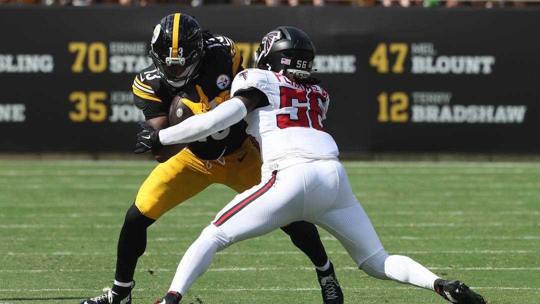Sep 13, 2026; Pittsburgh, Pennsylvania, USA;  Pittsburgh Steelers running back Rico Dowdle (13) runs after a catch against Atlanta Falcons linebacker Harold Perkins Jr. (56) during the third quarter at Acrisure Stadium.  Mandatory Credit: Charles LeClaire-Imagn Images