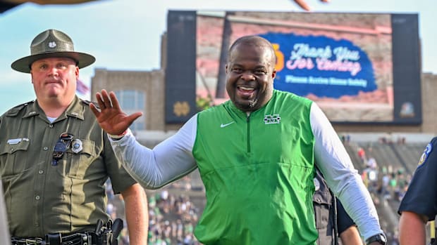 Marshall coach Charles Huff celebrates beating Notre Dame in 2022