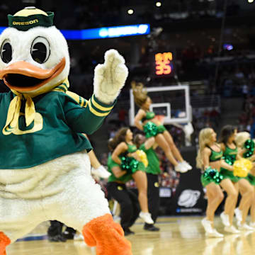 Mar 22, 2014; Milwaukee, WI, USA; Oregon Ducks mascot The Oregon Duck dances in the first half of a men's college basketball game against the Wisconsin Badgers during the third round of the 2014 NCAA Tournament at BMO Harris Bradley Center. Mandatory Credit: Benny Sieu-Imagn Images