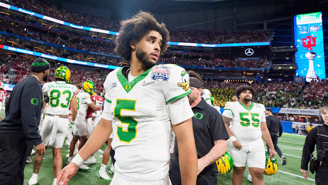 Oregon quarterback Dante Moore walks the field after the Ducks’ loss as the Oregon Ducks face the Indiana Hoosiers in the Peach Bowl on Jan. 9, 2026, at Mercedes-Benz Stadium in Atlanta, Georgia.