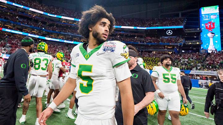 Oregon quarterback Dante Moore walks the field after the Ducks’ loss as the Oregon Ducks face the Indiana Hoosiers in the Peach Bowl on Jan. 9, 2026, at Mercedes-Benz Stadium in Atlanta, Georgia.