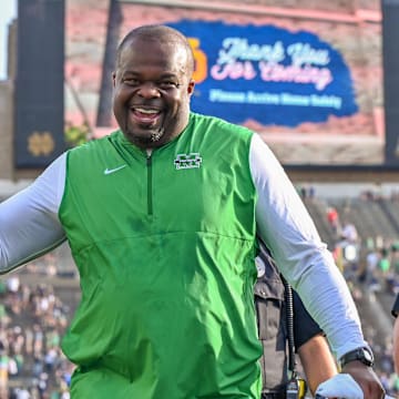 Marshall Thundering Herd head coach Charles Huff celebrates