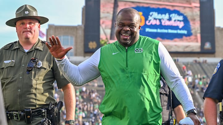 Marshall Thundering Herd head coach Charles Huff celebrates