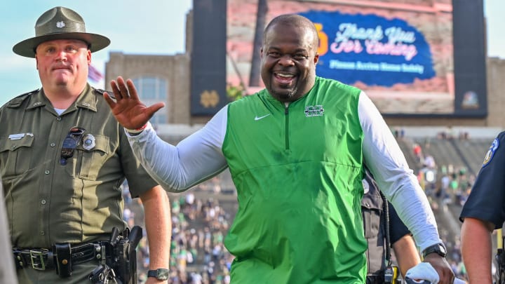 Sep 10, 2022; South Bend, Indiana, USA; Marshall Thundering Herd head coach Charles Huff celebrates as he leaves the field after the Thundering Herd beat the Notre Dame Fighting Irish 26-21 at Notre Dame Stadium. Mandatory Credit: Matt Cashore-USA TODAY Sports