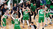 Jun 17, 2024; Boston, Massachusetts, USA; Boston Celtics forward Jayson Tatum (0) celebrates with forward Oshae Brissett (12) after defeating the Dallas Mavericks in game five to win the 2024 NBA Finals at TD Garden. Mandatory Credit: David Butler II-Imagn Images