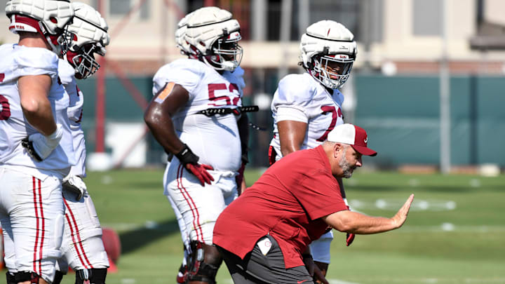 The Crimson Tide players and coaches continue working toward the season opener in practice Tuesday, Aug. 13, 2024. Alabama offensive line coach Chris Kapilovic directs his linemen.