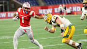 Catholic Memorial's Mekhi Dodd stiff-arms King Philip's Aiden Astorino during a game in the Division 2 Super Bowl at Gillette Stadium on Thursday, Dec. 5, 2024.