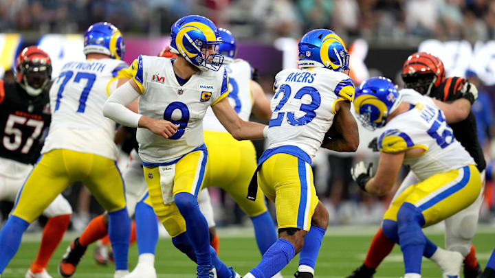 Los Angeles Rams quarterback Matthew Stafford (9) hands the ball off to Los Angeles Rams running back Cam Akers