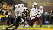 Nov 8, 2025; Columbia, Missouri, USA; Texas A&M Aggies wide receiver Mario Craver (1) runs with the ball against Missouri Tigers cornerback Toriano Pride Jr. (2) during the second half at Faurot Field at Memorial Stadium. Mandatory Credit: Jay Biggerstaff-Imagn Images