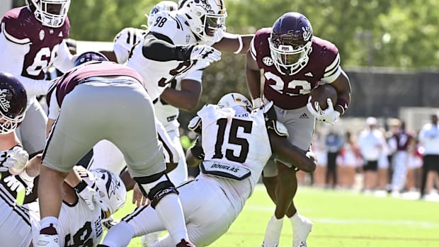 Mississippi State Bulldogs running back Seth Davis (23) runs the ball while defended by Joshua Nobles
