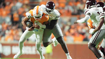 Nov 9, 2024; Knoxville, Tennessee Volunteers, USA; Tennessee Volunteers quarterback Nico Iamaleava (8) is sacked by the Mississippi State Bulldogs during the first half at Neyland Stadium. Mandatory Credit: Caitie McMekin/USA TODAY Network via Imagn Images