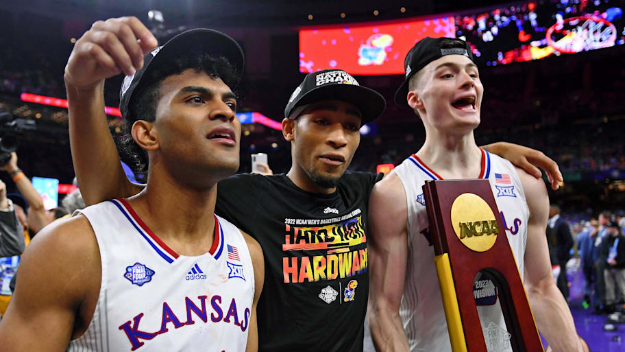 Kansas Jayhawks Remy Martin, Dajuan Harris Jr. and Christian Braun celebrate their win against the North Carolina Tar Heels.
