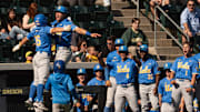 UCLA players celebrate as they break out the bats in the 7th inning to defeat the Oregon Ducks at PK Park in Eugene April 19, 2025