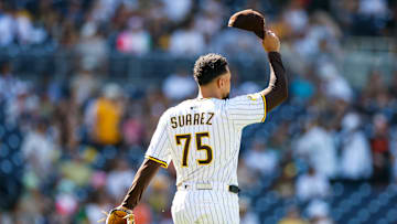 Sep 3, 2025; San Diego, California, USA; San Diego Padres relief pitcher Robert Suarez (75) tips his hat after left fielder Ramon Laureano (5) robs a home run during the ninth inning against the Baltimore Orioles at Petco Park. Mandatory Credit: David Frerker-Imagn Images
