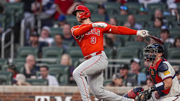 Jul 3, 2025; Cumberland, Georgia, USA; Los Angeles Angels left fielder Taylor Ward (3) follows through after hitting a triple to drive in a run against the Atlanta Braves during the sixth inning at Truist Park. Mandatory Credit: Dale Zanine-Imagn Images