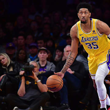 Jan 3, 2024; Los Angeles, California, USA; Los Angeles Lakers forward Christian Wood (35) moves the ball against the Miami Heat during the second half at Crypto.com Arena. Mandatory Credit: Gary A. Vasquez-Imagn Images