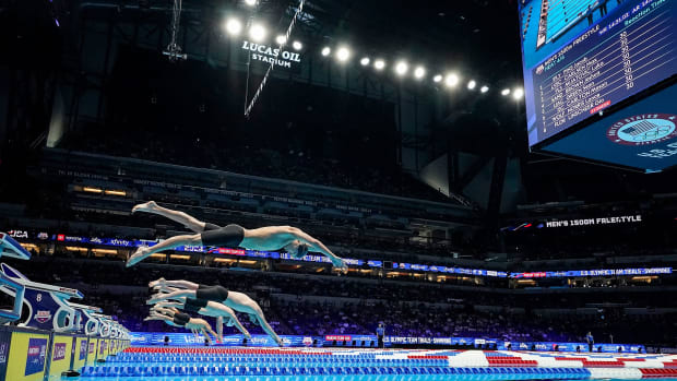 Swimmers dive into the pool for the 1,500 meter freestyle swim during prelims for the U.S. Olympic Team Swimming Trials.