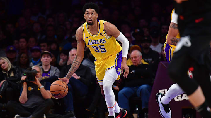 Jan 3, 2024; Los Angeles, California, USA; Los Angeles Lakers forward Christian Wood (35) moves the ball against the Miami Heat during the second half at Crypto.com Arena. Mandatory Credit: Gary A. Vasquez-Imagn Images