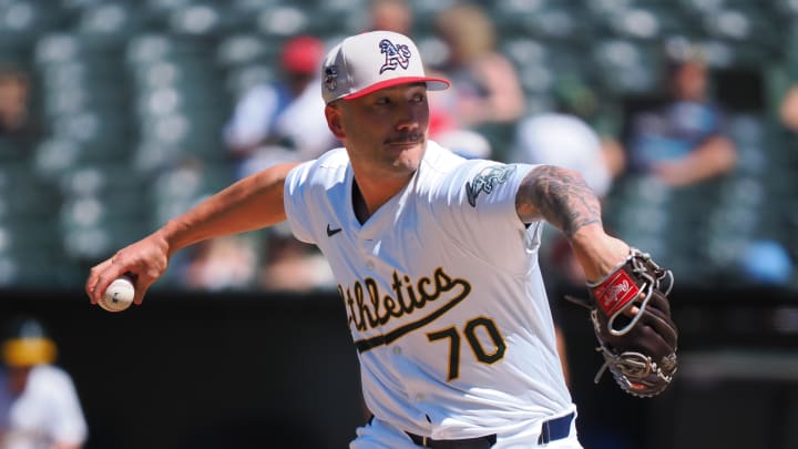 Jul 4, 2024; Oakland, California, USA; Oakland Athletics relief pitcher Lucas Erceg (70) pitches the ball against the Los Angeles Angels during the eighth inning at Oakland-Alameda County Coliseum. Mandatory Credit: Kelley L Cox-USA TODAY Sports