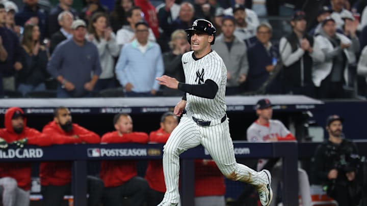 Oct 2, 2025; Bronx, New York, USA; New York Yankees outfielder Cody Bellinger (35) runs to home plate in the fourth inning against the Boston Red Sox during game three of the Wildcard round for the 2025 MLB playoffs at Yankee Stadium. Mandatory Credit: Vincent Carchietta-Imagn Images