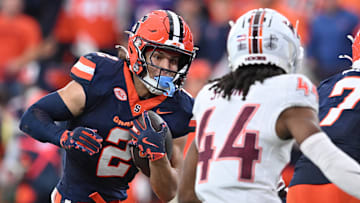 Nov 2, 2024; Syracuse, New York, USA; Syracuse Orange wide receiver Trebor Pena (2) tries to avoid a tackle by Virginia Tech Hokies cornerback Dorian Strong (44) in the third quarter at JMA Wireless Dome. Mandatory Credit: Mark Konezny-Imagn Images