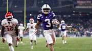 Dec 26, 2024; Phoenix, AZ, USA; Kansas State Wildcats running back Dylan Edwards (3) runs for a touchdown against the Rutgers Scarlet Knights during the second half of the Rate Bowl at Chase Field. Mandatory Credit: Mark J. Rebilas-Imagn Images