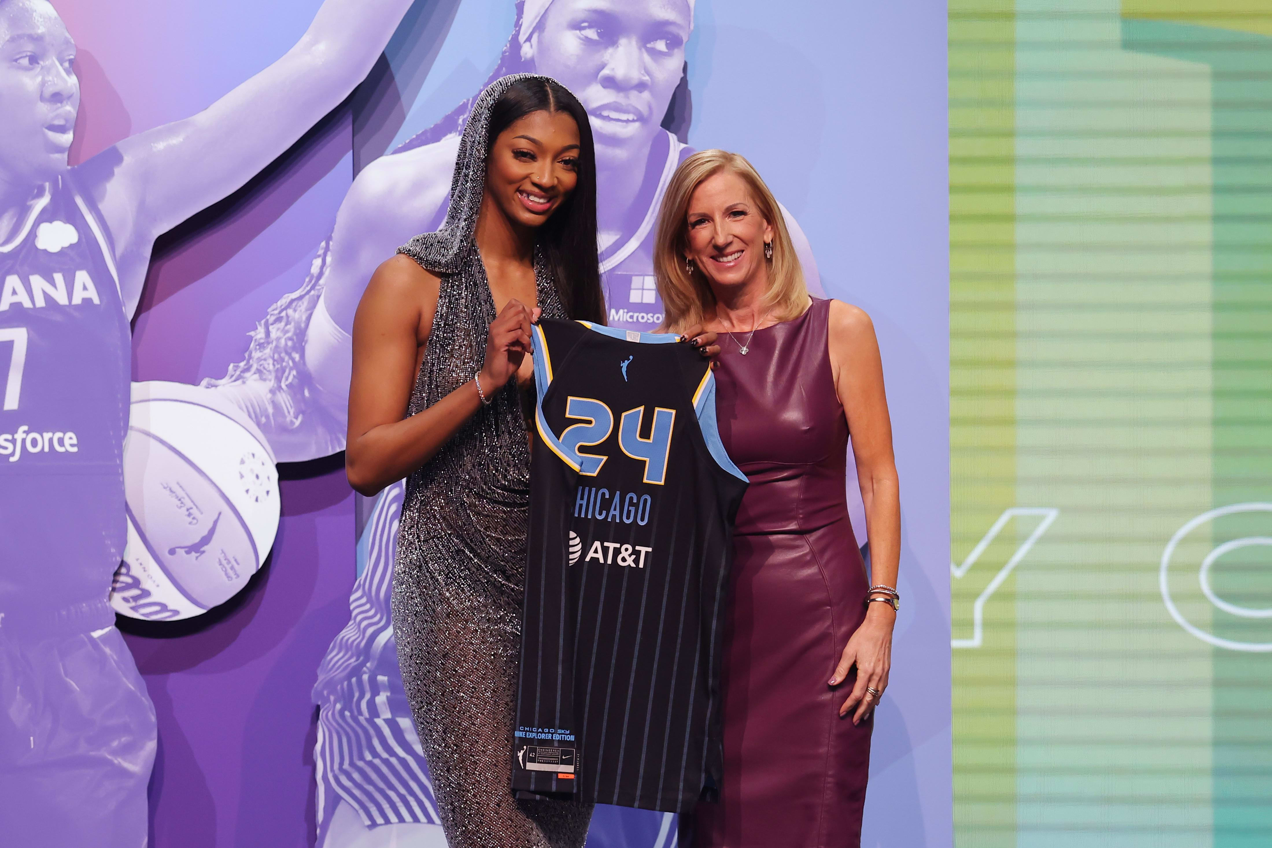 Angel Reese poses with WNBA commissioner Cathy Engelbert.