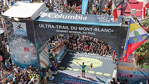 A runner finishes the UTMB trail race