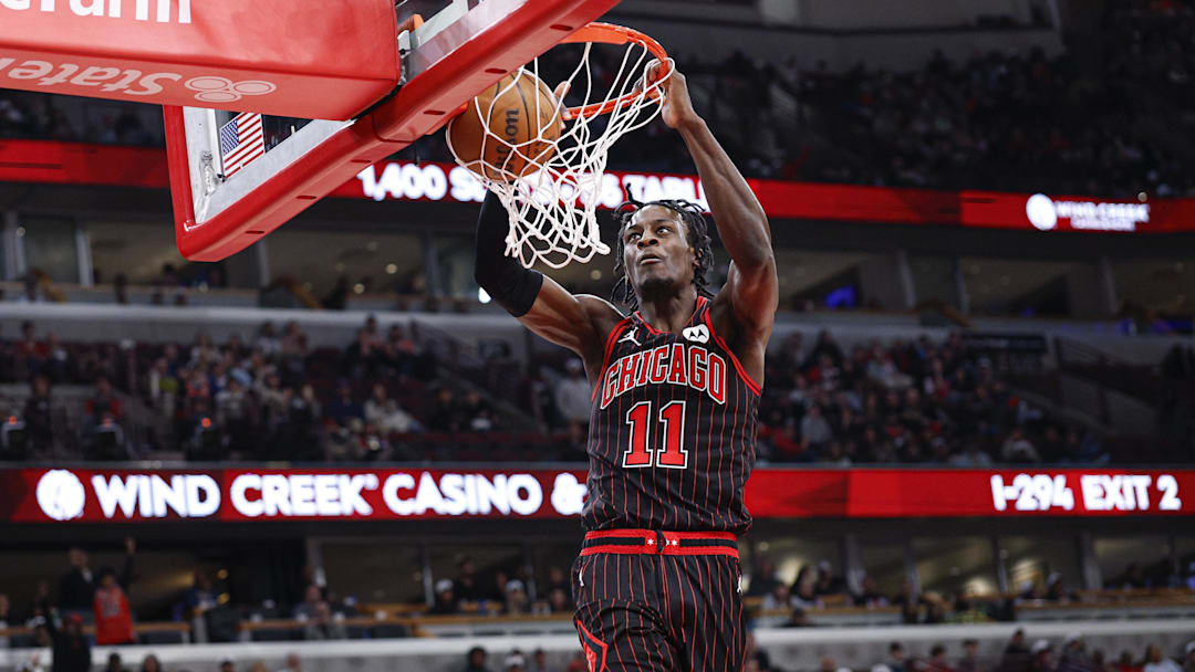 Mar 18, 2026; Chicago, Illinois, USA; Chicago Bulls forward Leonard Miller (11) scores against the Toronto Raptors during the second half at United Center. Mandatory Credit: Kamil Krzaczynski-Imagn Images