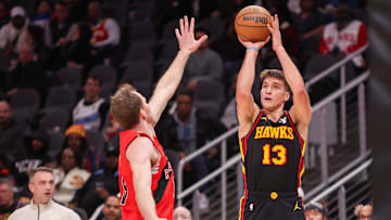 Jan 23, 2025; Atlanta, Georgia, USA; Atlanta Hawks guard Bogdan Bogdanovic (13) shoots against the Toronto Raptors in the second quarter at State Farm Arena. Mandatory Credit: Brett Davis-Imagn Images
