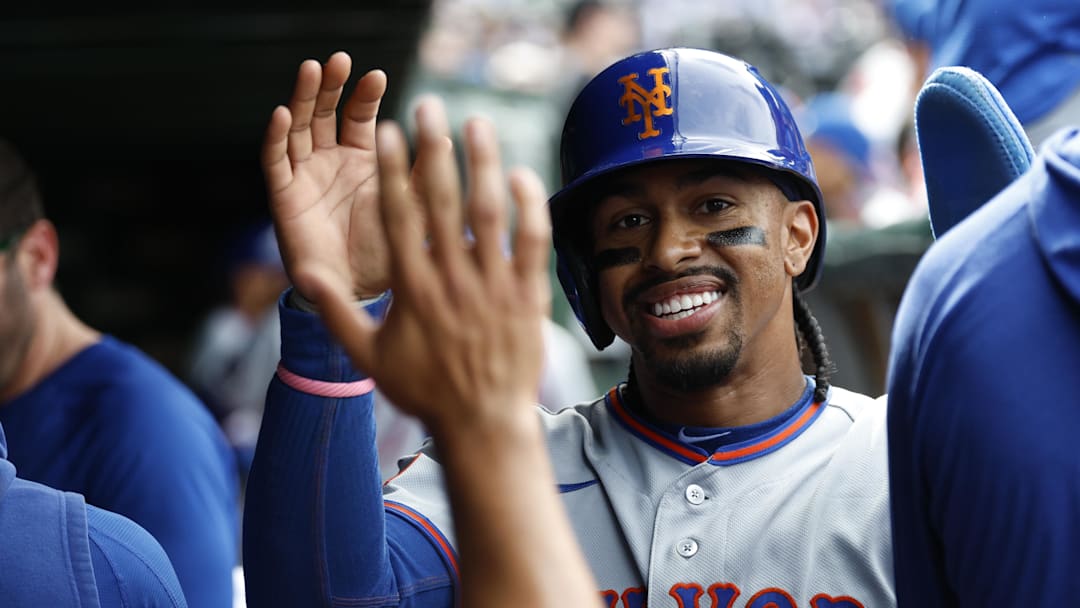 Apr 17, 2026; Chicago, Illinois, USA; New York Mets shortstop Francisco Lindor (12) celebrates with teammates after scoring against the Chicago Cubs during the eight inning at Wrigley Field. Mandatory Credit: Kamil Krzaczynski-Imagn Images