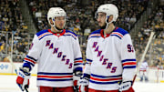 Jan 14, 2018; Pittsburgh, PA, USA;  New York Rangers left wing J.T. Miller (10) and center Mika Zibanejad (93) talk prior to a face-off against the Pittsburgh Penguins during the second period at PPG PAINTS Arena. The Penguins won 5-2. Mandatory Credit: Charles LeClaire-Imagn Images