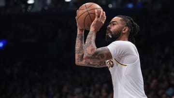 Mar 31, 2024; Brooklyn, New York, USA; Los Angeles Lakers guard D'Angelo Russell (1) shoots during the second half against the Brooklyn Nets at Barclays Center. 