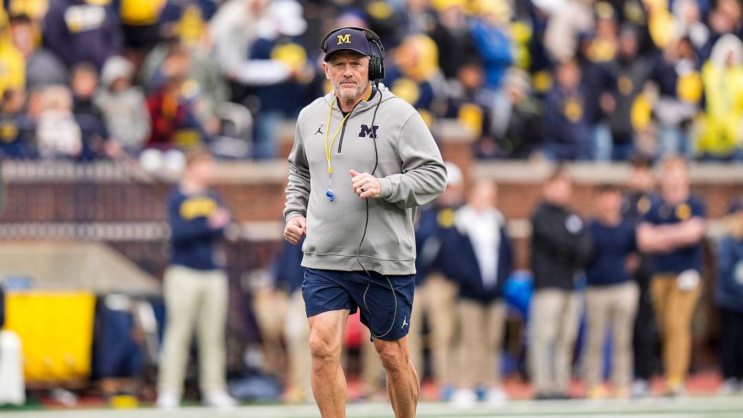 Michigan head coach Kyle Whittingham runs across the field during the spring game at Michigan Stadium in Ann Arbor on Saturday, April 18, 2026. Michigan head coach Kyle Whittingham runs across the field during the spring game at Michigan Stadium in Ann Arbor on Saturday, April 18, 2026.