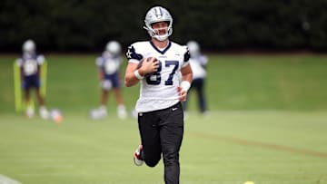 Jun 4, 2024; Frisco, TX, USA;  Dallas Cowboys tight end Jake Ferguson (87) goes through a drill during practice at the Ford Center at the Star Training Facility in Frisco, Texas. Mandatory Credit: Tim Heitman-Imagn Images