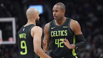 Jan 15, 2025; Toronto, Ontario, CAN; Boston Celtics center Al Horford (42) talks to guard Derrick White (9) during the first half against the Toronto Raptors at Scotiabank Arena. Mandatory Credit: John E. Sokolowski-Imagn Images