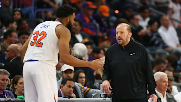 Nov 20, 2024; Phoenix, Arizona, USA; New York Knicks head coach Tom Thibodeau with center Karl-Anthony Towns (32) against the Phoenix Suns at Footprint Center. Mandatory Credit: Mark J. Rebilas-Imagn Images