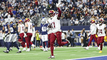 Jan 5, 2025; Arlington, Texas, USA;  Washington Commanders wide receiver Terry McLaurin (17) celebrates after scoring the game-winning touchdown  during the fourth quarter against the Dallas Cowboys at AT&T Stadium. Mandatory Credit: Kevin Jairaj-Imagn Images