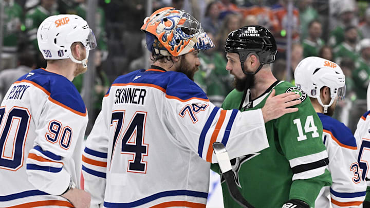 Edmonton Oilers goaltender Stuart Skinner reacts with Dallas Stars left wing Jamie Benn.
