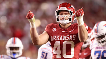 Nov 23, 2024; Fayetteville, Arkansas, USA; Arkansas Razorbacks defensive lineman Landon Jackson (40) celebrates after sacking Louisiana Tech Bulldogs quarterback Evan Bullock (7) during the fourth quarter at Donald W. Reynolds Razorback Stadium. Arkansas won 35-14. Mandatory Credit: Nelson Chenault-Imagn Images