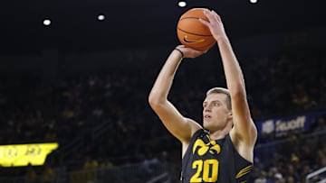 Dec 7, 2024; Ann Arbor, Michigan, USA;  Iowa Hawkeyes forward Payton Sandfort (20) shoots in the second half against the Michigan Wolverines at Crisler Center. Mandatory Credit: Rick Osentoski-Imagn Images