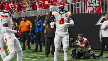 Sep 22, 2024; Atlanta, Georgia, USA; Kansas City Chiefs wide receiver Rashee Rice (4) reacts after scoring a touchdown against the Atlanta Falcons during the first half at Mercedes-Benz Stadium. Mandatory Credit: Dale Zanine-Imagn Images