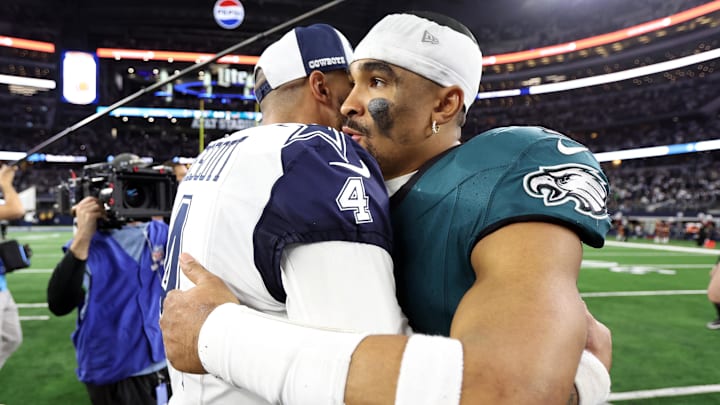 Dec 10, 2023; Arlington, Texas, USA; Dallas Cowboys quarterback Dak Prescott (4) hugs Philadelphia Eagles quarterback Jalen Hurts (1) after the game at AT&T Stadium. Mandatory Credit: Tim Heitman-Imagn Images