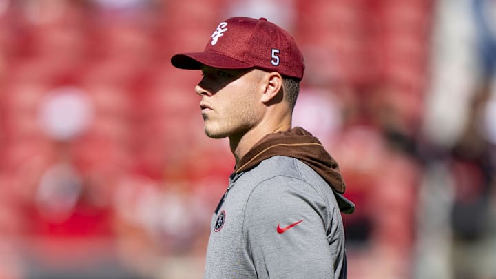 McCaffrey watches warm ups before the game against the New Orleans Saints at Levi's Stadium.