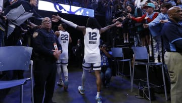 Apr 4, 2023; Memphis, Tennessee, USA; Memphis Grizzlies guard Ja Morant (12) interacts with fans as he walks off the court after the game against the Portland Trail Blazers at FedExForum. Mandatory Credit: Petre Thomas-USA TODAY Sports